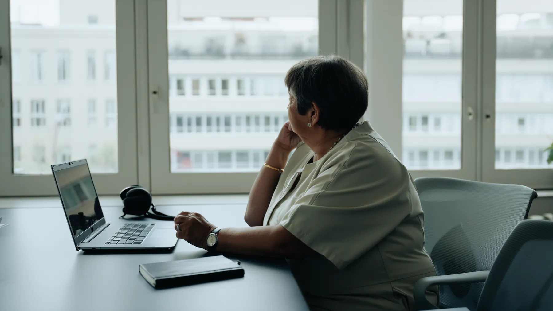 A care coordinator at her desk in a bright office
